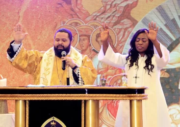 Dr Shawn and Dr Annie Smith praying durant the resurrection sunday service.